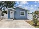 Charming blue single-story home featuring a well-manicured yard and a inviting front entrance at 1432 Selma Ave, Orlando, FL 32825