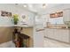 Bright kitchen features white cabinets, and tile floors, plus an island with bar seating at 1432 Selma Ave, Orlando, FL 32825