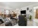 Spacious living area with neutral tones, modern furnishings, and easy access to the dining and kitchen areas at 1432 Selma Ave, Orlando, FL 32825