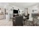 Well-lit living area with comfortable seating, a neutral color palette, and easy access to other rooms at 1432 Selma Ave, Orlando, FL 32825