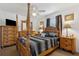 The main bedroom showcases a four-poster bed, elegant wood furniture, and plush bedding at 1432 Selma Ave, Orlando, FL 32825