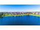 A lovely lakeside property with a well-maintained green lawn and scenic water views at 14753 Snowy Egret St, Winter Garden, FL 34787