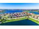A charming residential area is showcased with a lakeside home and scenic surroundings, enhanced by a lush green landscape at 14753 Snowy Egret St, Winter Garden, FL 34787