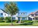 Charming two-story home with a well-manicured lawn, beautiful landscaping, and inviting curb appeal on a sunny day at 14753 Snowy Egret St, Winter Garden, FL 34787