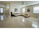 Spacious living room with modern furnishings, tiled floors, and plenty of natural light at 14753 Snowy Egret St, Winter Garden, FL 34787