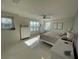 Sunlit main bedroom with neutral tones, tile flooring, and dual windows offering natural light and views at 14753 Snowy Egret St, Winter Garden, FL 34787