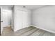 Bedroom featuring laminate floors and a closet at 174 Pine Grove Ct, Daytona Beach, FL 32119
