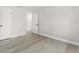 Bedroom with a large closet, durable laminate floors, and fresh paint at 174 Pine Grove Ct, Daytona Beach, FL 32119