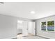 Bright bedroom featuring a window with a green view and access to an ensuite bathroom at 174 Pine Grove Ct, Daytona Beach, FL 32119