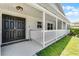 Welcoming front porch featuring a double door entrance, fresh white paint, and classic architecture at 174 Pine Grove Ct, Daytona Beach, FL 32119