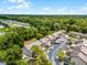 Aerial view of townhome community showcasing beautiful landscaping and serene surroundings at 179 Crown Point Cir, Longwood, FL 32779