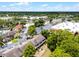 Aerial view of townhomes in a community with retail close by and beautiful wooded land at 179 Crown Point Cir, Longwood, FL 32779
