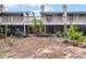 View of back of home with a patio and a backyard filled with landscaping potential at 179 Crown Point Cir, Longwood, FL 32779