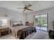 Bedroom featuring a ceiling fan and sliding glass doors to a patio at 179 Crown Point Cir, Longwood, FL 32779