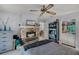 Bedroom featuring a stone fireplace, ceiling fan, and built-in shelving at 179 Crown Point Cir, Longwood, FL 32779