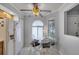 Charming dining area with a decorative ceiling fan, bright windows, and seating for four at 179 Crown Point Cir, Longwood, FL 32779