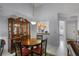 Dining area featuring a display cabinet and a view into the kitchen at 179 Crown Point Cir, Longwood, FL 32779