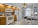 Bright kitchen featuring a ceiling fan and a breakfast nook with lots of light at 179 Crown Point Cir, Longwood, FL 32779