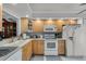 Efficient kitchen with updated appliances, light cabinets, and ample counter space at 179 Crown Point Cir, Longwood, FL 32779