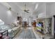 Spacious living room with vaulted ceiling, fan, and stone fireplace at 179 Crown Point Cir, Longwood, FL 32779