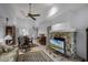 Open concept living room with stone fireplace and vaulted ceilings at 179 Crown Point Cir, Longwood, FL 32779