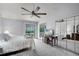 Light-filled main bedroom with balcony access, mirrored closet, and ceiling fan at 179 Crown Point Cir, Longwood, FL 32779