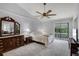 Spacious main bedroom with vaulted ceilings, ceiling fan, and a balcony with sliding glass doors at 179 Crown Point Cir, Longwood, FL 32779