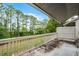 Outdoor patio with a view of green space and the surrounding trees at 179 Crown Point Cir, Longwood, FL 32779