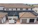 Overhead view of the backyard featuring the pool, outdoor patio, screened-in patio and garage at 1943 Majorca Dr, Kissimmee, FL 34747