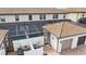 Aerial view of the backyard featuring a screened-in pool, patio, and the home's outdoor landscape at 1943 Majorca Dr, Kissimmee, FL 34747