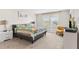 Light-filled bedroom with plush carpet and a view from the window at 1943 Majorca Dr, Kissimmee, FL 34747