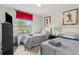 Bright bedroom featuring two twin beds, red curtains, and natural light at 1943 Majorca Dr, Kissimmee, FL 34747