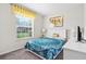 Bright bedroom features a large window and white furniture, creating a serene atmosphere at 1943 Majorca Dr, Kissimmee, FL 34747