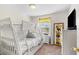 Bedroom featuring white bunk beds, yellow valance, and neutral walls at 1943 Majorca Dr, Kissimmee, FL 34747