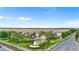 Beautiful view of the Windsor community entrance with manicured landscaping, fountain, and rows of townhomes in the background at 1943 Majorca Dr, Kissimmee, FL 34747