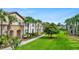 Well-manicured lawn and community landscaping add to the appeal of this townhome community at 1943 Majorca Dr, Kissimmee, FL 34747