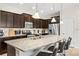 Modern kitchen features granite counters, stainless appliances, dark cabinets, and bar top seating at 1943 Majorca Dr, Kissimmee, FL 34747