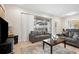 Comfortable living room with a sliding glass door providing ample natural light and access to backyard at 1943 Majorca Dr, Kissimmee, FL 34747