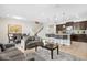 Open-concept living area flows into a dining space and features a breakfast bar with pendant lighting at 1943 Majorca Dr, Kissimmee, FL 34747