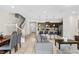Spacious living area boasts tile floors, leading into a modern kitchen with stainless steel appliances at 1943 Majorca Dr, Kissimmee, FL 34747