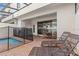 Back patio featuring lounge chairs, dining set, outdoor access, brick pavers and a screened in ceiling at 1943 Majorca Dr, Kissimmee, FL 34747