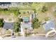 Birds eye view of a home with a pool, boats and greenery nestled among neighboring houses at 1962 English Dr, Deltona, FL 32738