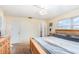 Primary bedroom with ceiling fan, closet and ensuite bath at 1962 English Dr, Deltona, FL 32738