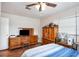 Bedroom featuring wood floors, a ceiling fan, and traditional wooden furniture at 1962 English Dr, Deltona, FL 32738