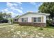 Well-maintained single-story home with manicured lawn and lush landscaping at 1962 English Dr, Deltona, FL 32738