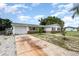 Charming single-story home featuring a one car garage and long driveway at 1962 English Dr, Deltona, FL 32738