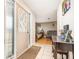 Welcoming foyer featuring tile flooring, a decorative table, and a view into the cozy living room at 1962 English Dr, Deltona, FL 32738