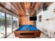 Spacious game room with a pool table, wood ceiling, and sliding glass doors to the outdoors at 1962 English Dr, Deltona, FL 32738