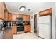 Bright kitchen with tile floor, oak cabinets, and walk-in pantry at 1962 English Dr, Deltona, FL 32738