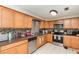 Well-equipped kitchen with stainless steel appliances, granite countertops, and mosaic backsplash at 1962 English Dr, Deltona, FL 32738
